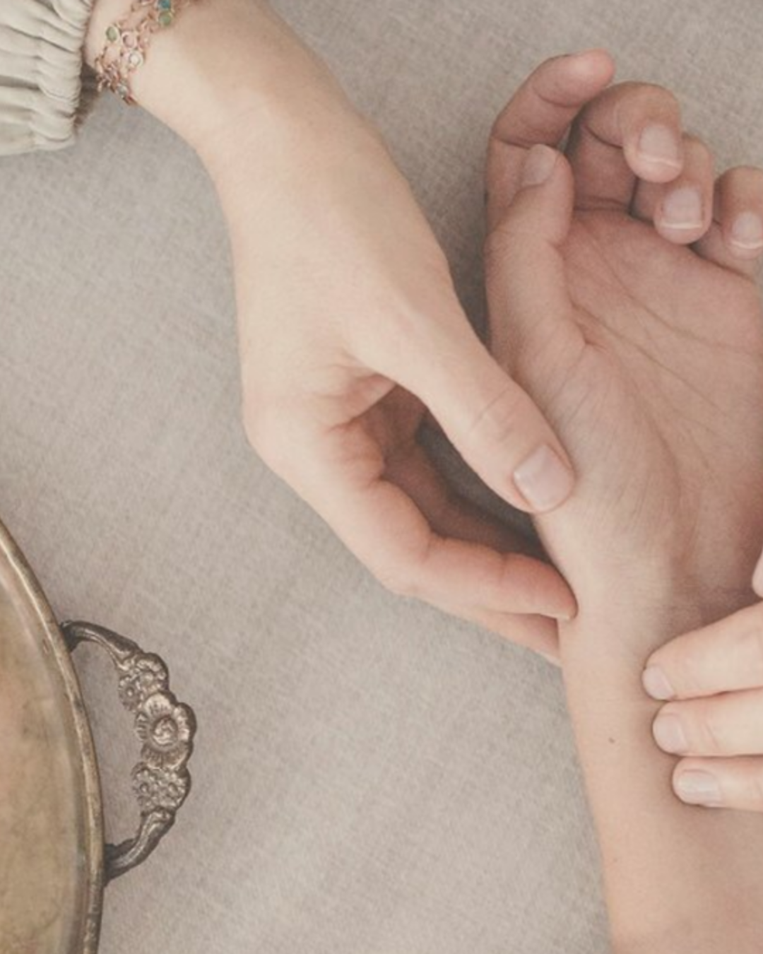 a client receiving pulse diagnostic for holistic Ayurvedic health assessment