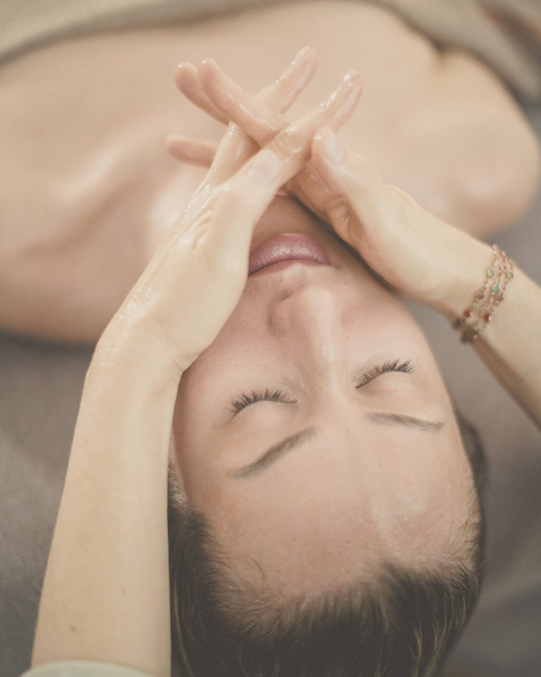 woman receiving an Ayurvedic Mukhabhyanga - head, scalp and face massage